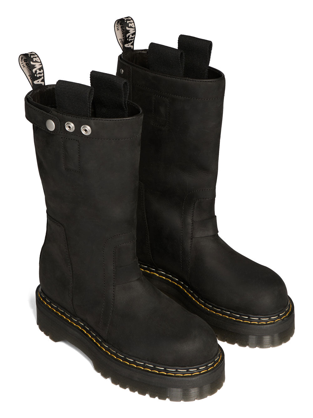 Angled view of Rick Owens x Dr. Martens black nubuck boots showing pull tabs, snap hardware and yellow welt stitching.