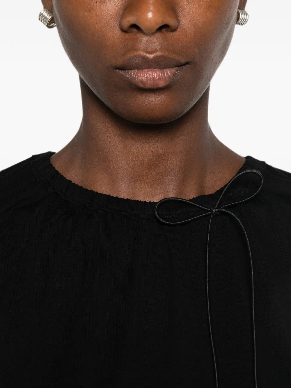 Close-up of Simone Rocha Cord Neck Easy T-Shirt in black showing gathered crew neck, cord tie and bow detail