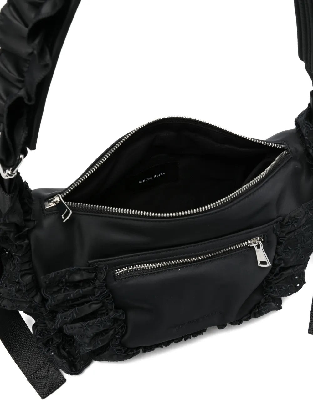 Close-up of the Pillowcase Shoulder Bag with the top opened, revealing the interior compartment and magnetic hinge frame closure.