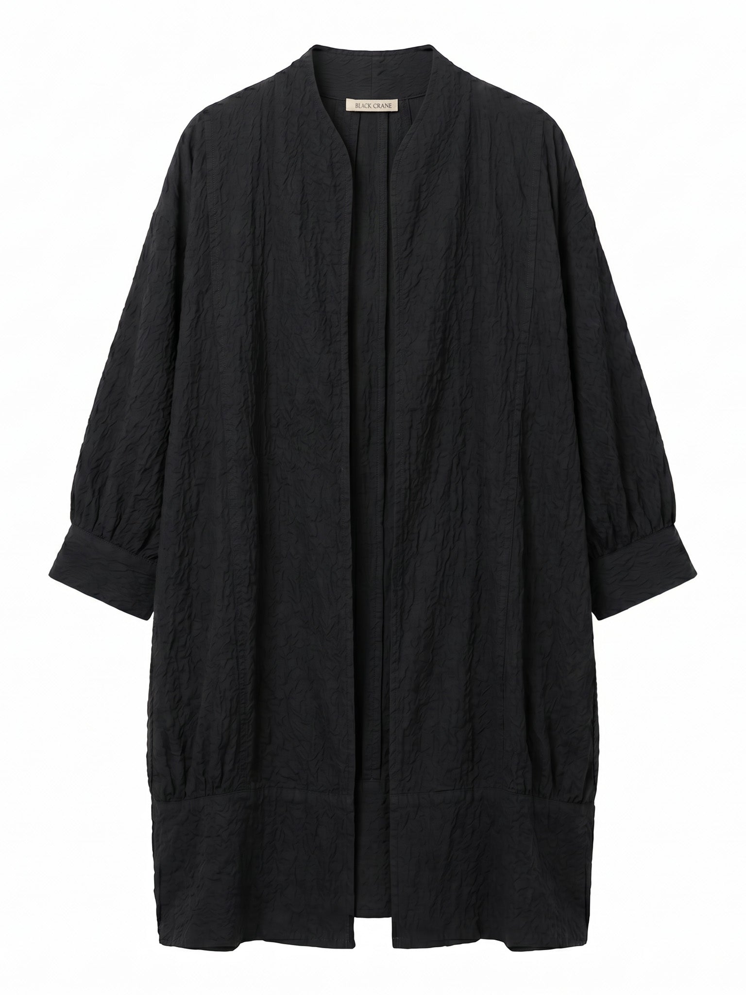 Black Crane Spoon Jacket in Midnight - flat lay showing oversized silhouette and balloon shaped sleeves in ripple textured Japanese cotton