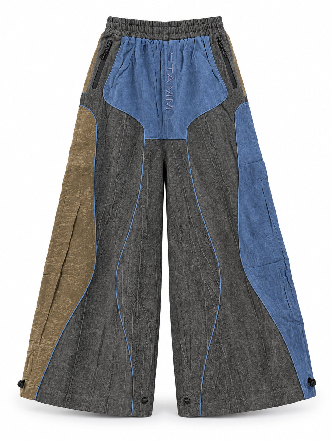 Stamm Exchange Center Vibe Pants in Grey/Blue/Brown, front view showing the wide-leg silhouette, curved contrasting panels, zipped pockets and STAMM logo detail.