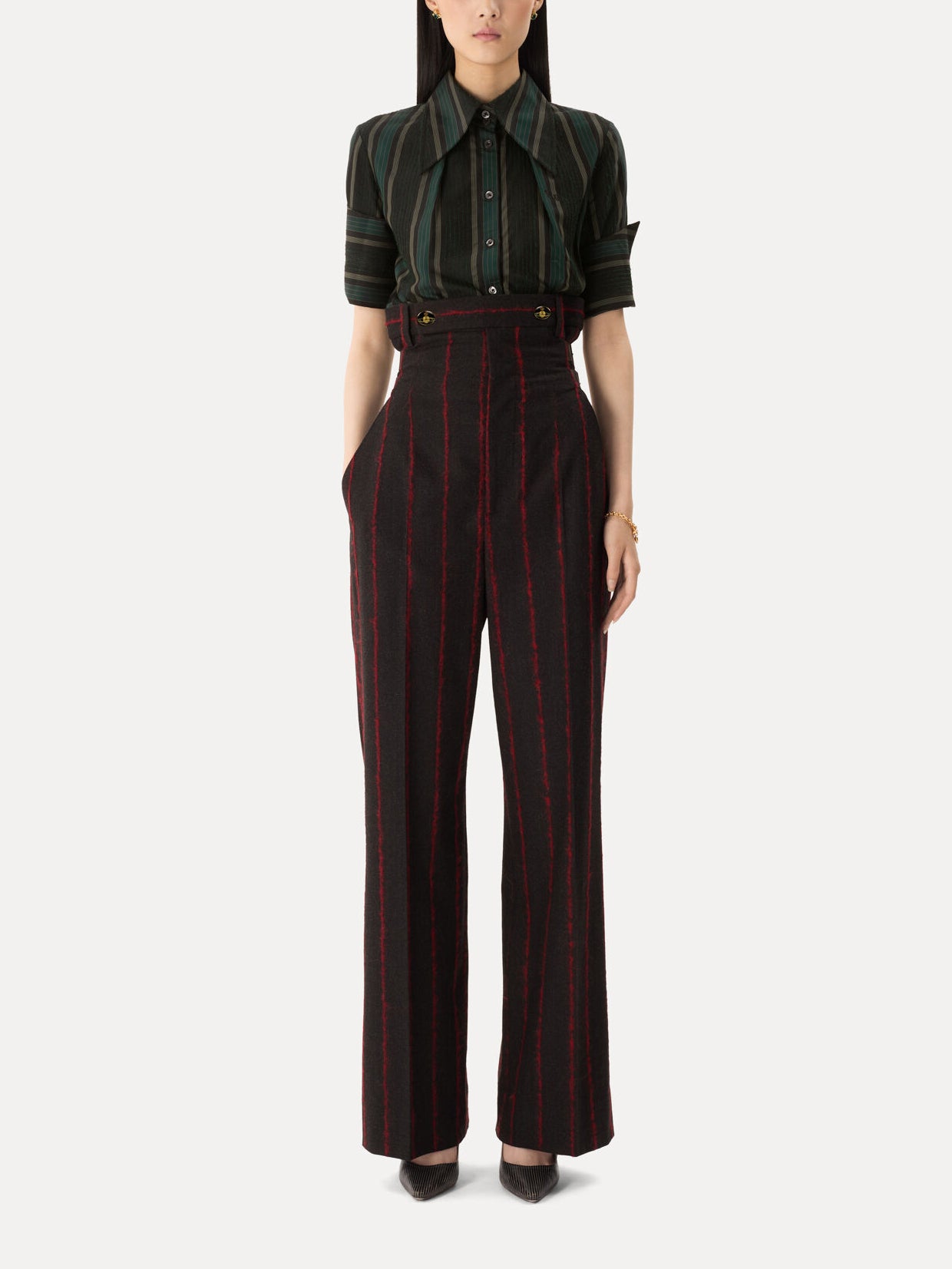 Model wearing Vivienne Westwood Waisted Lauren Trousers in charcoal red stripe with high waist, wide legs and tailored pleats