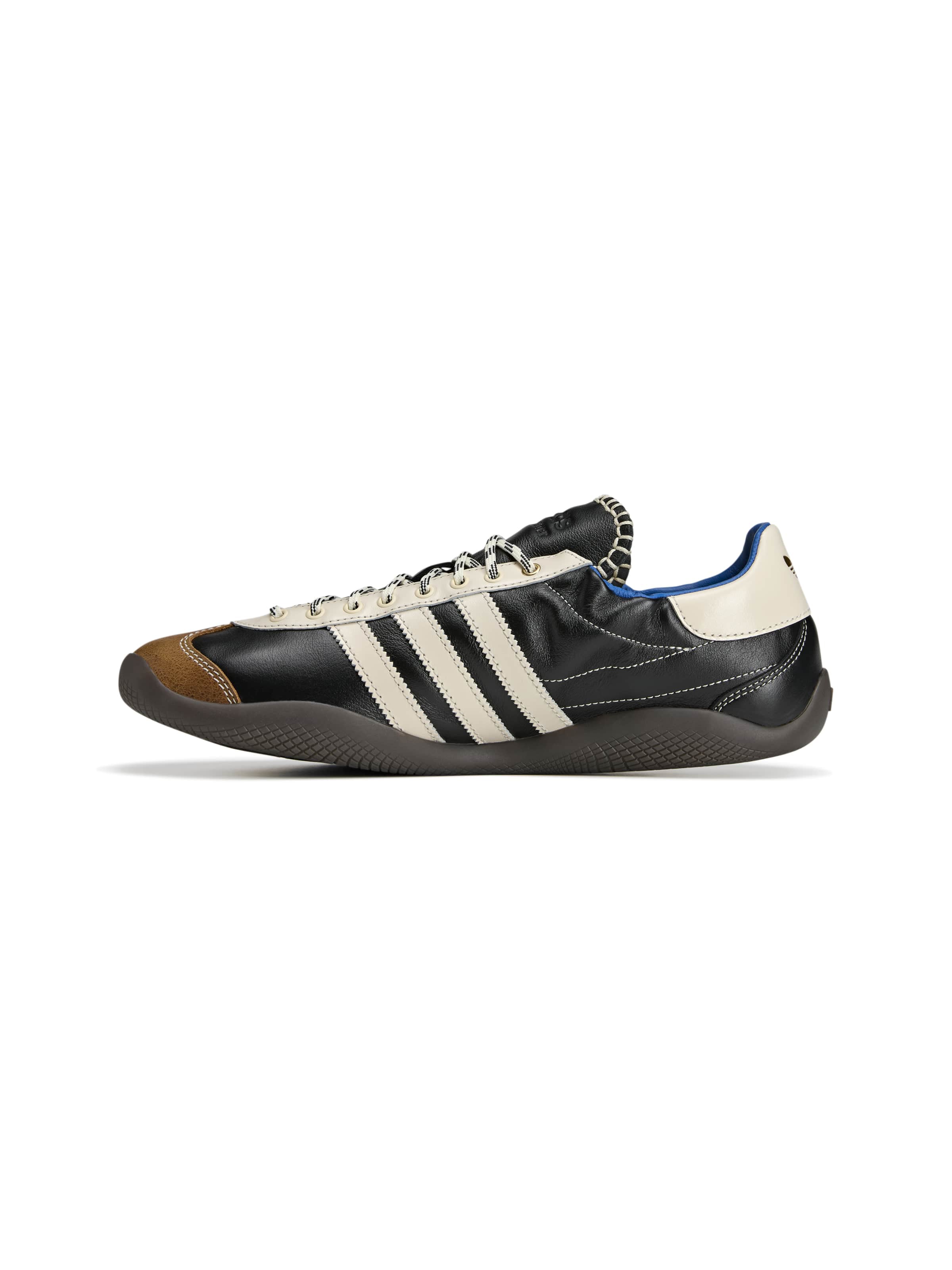 Wales Bonner x Adidas Karintha OG in Core Black Wonder White Lush Blue black leather sneaker with three-stripe detail and tan panel, diagonal side view – Wales Bonner x Adidas SS26