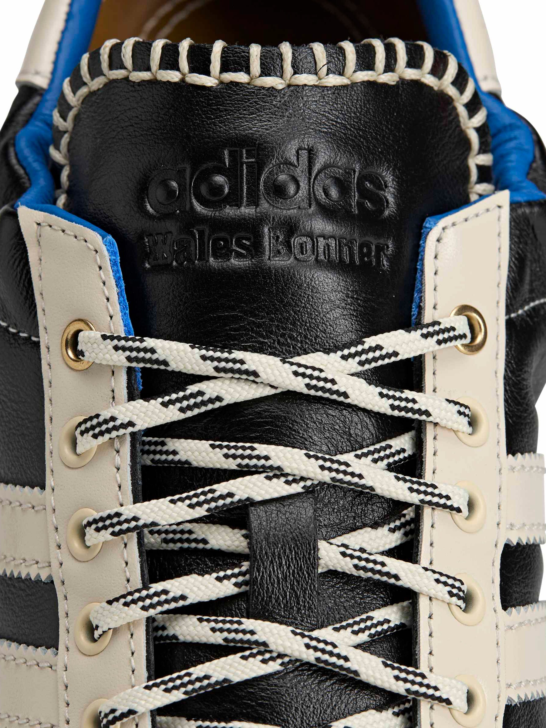 Close-up of gold-tone eyelets, leather lacing and Adidas branding on the Wales Bonner x Adidas Karintha OG in Core Black Wonder White Lush Blue – Wales Bonner x Adidas SS26