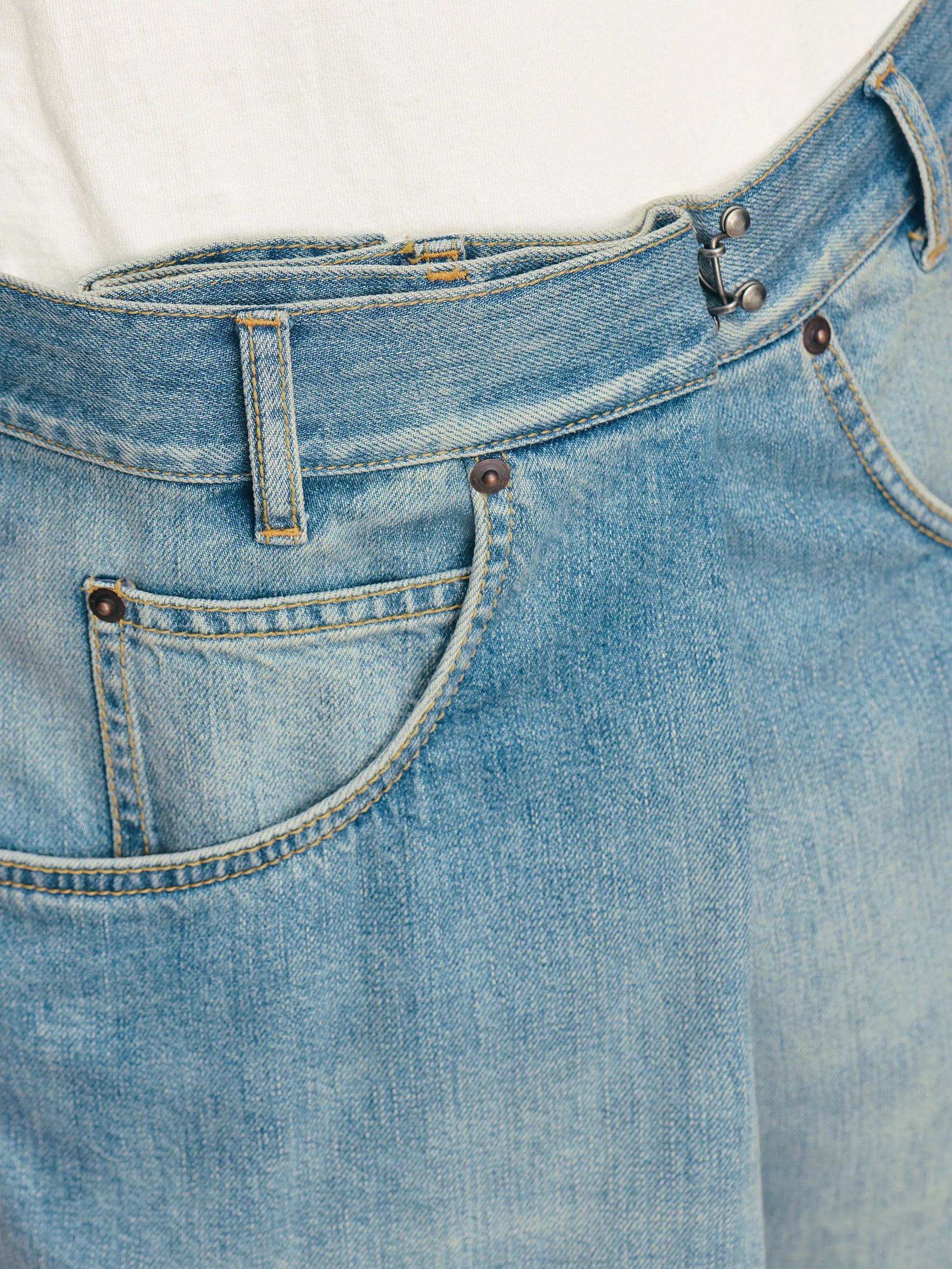 Close-up of front pocket and Margiela Hook detail on Maison Margiela Wrap Denim Trousers