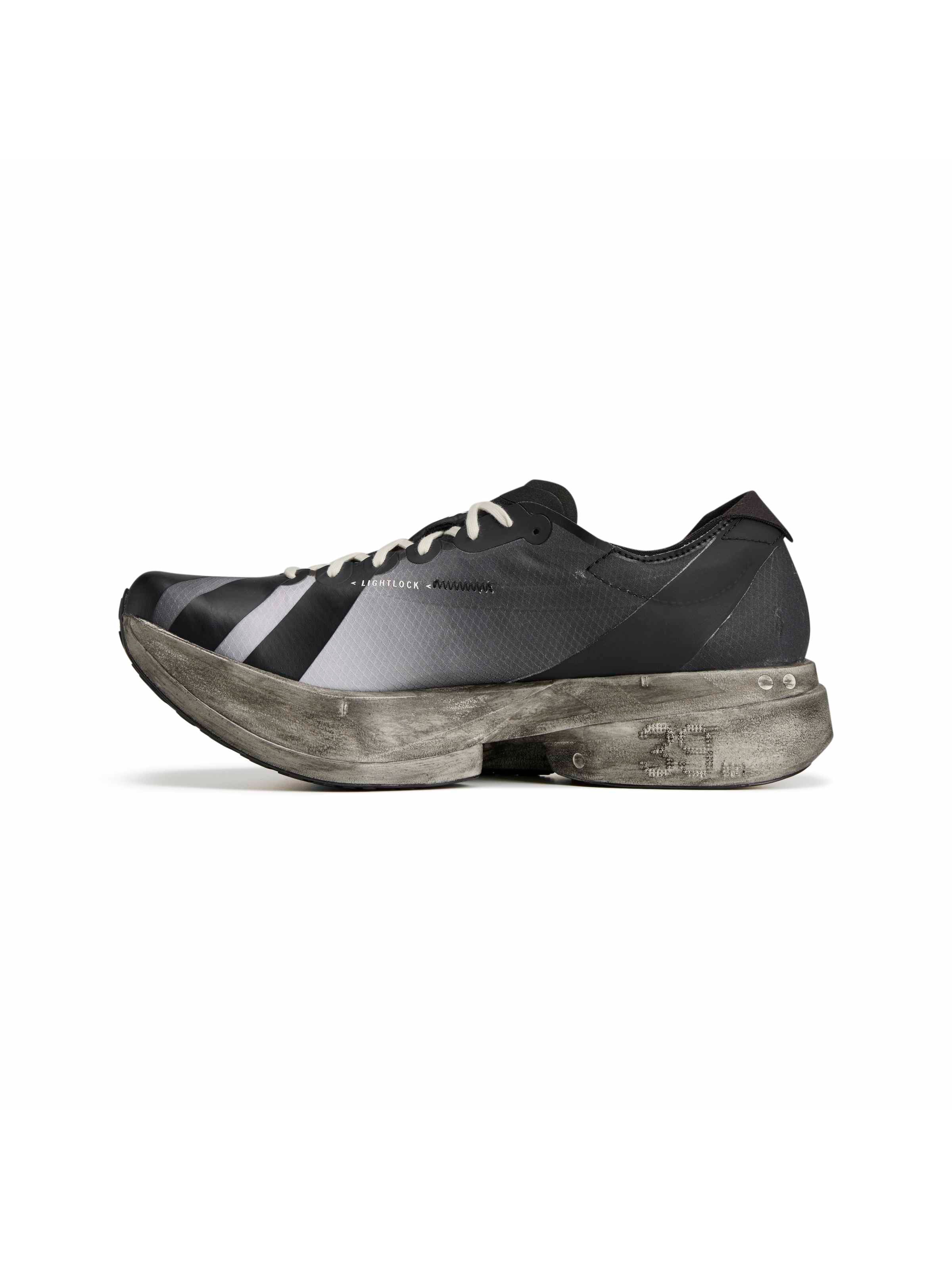 Y-3 Adios Pro 4 front-facing view, black streamlined toe, off-white rope laces, grey 3-Stripes, distressed midsole edge