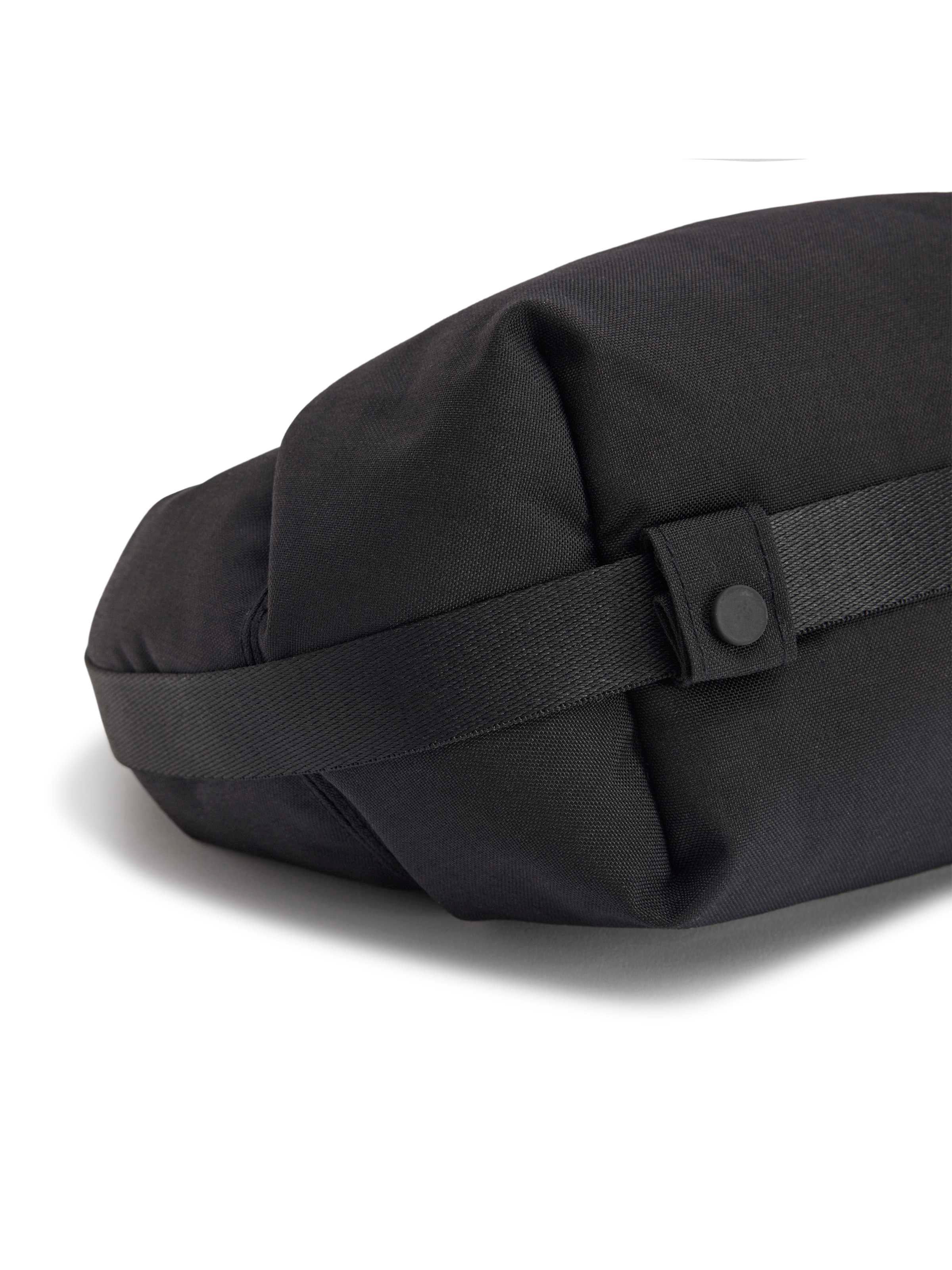 Y-3 Crescent Bag in Black, back view, adjustable webbing strap, gunmetal buckle hardware, plain weave reverse, full black lining visible at opening